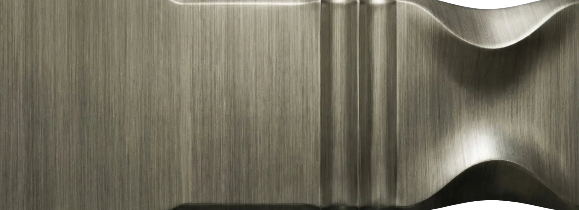 Brushed Zinc architectural metal finish sample by Modulux with soft silver-grey tone, fine linear brushing, and sculpted profile details.
