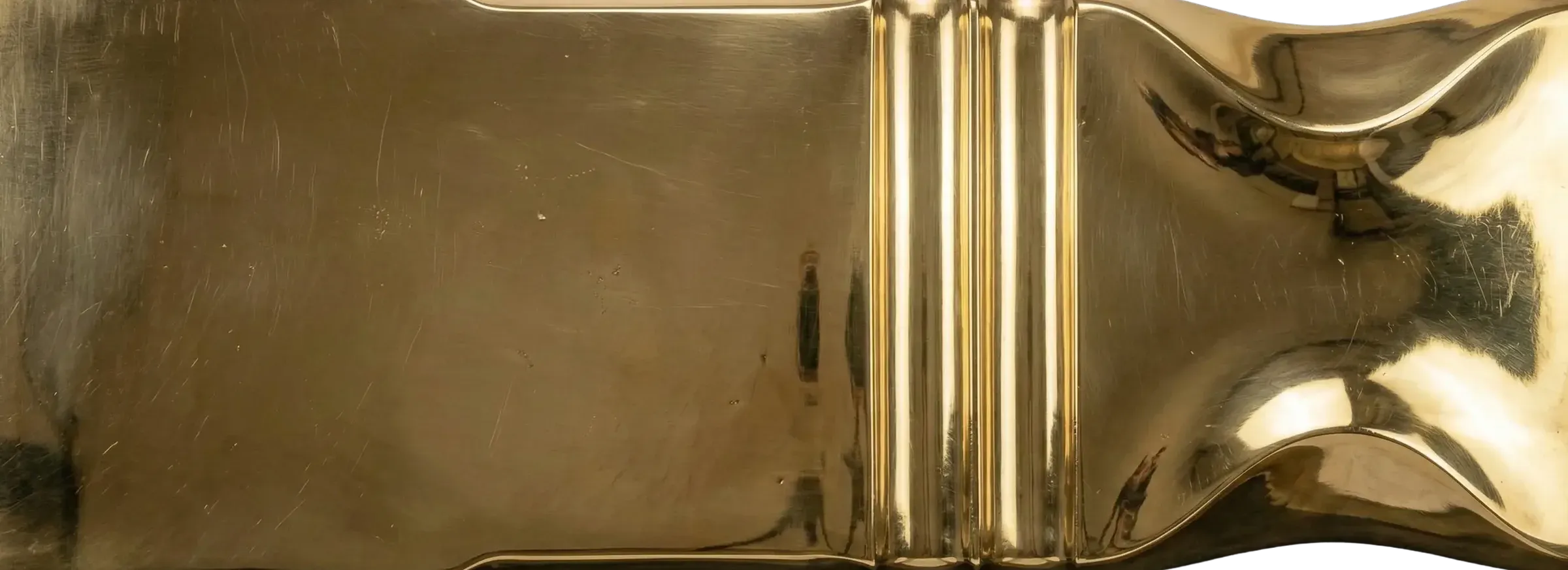 Polished Brass architectural finish sample with a bright reflective brass surface and mirror-like sheen